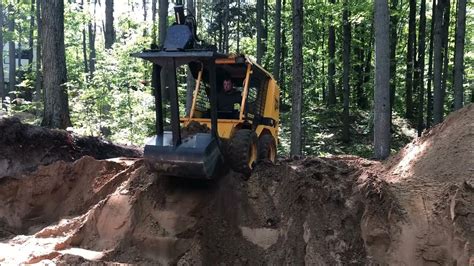 digging a basement with a skid steer|youtube skid steer loader.